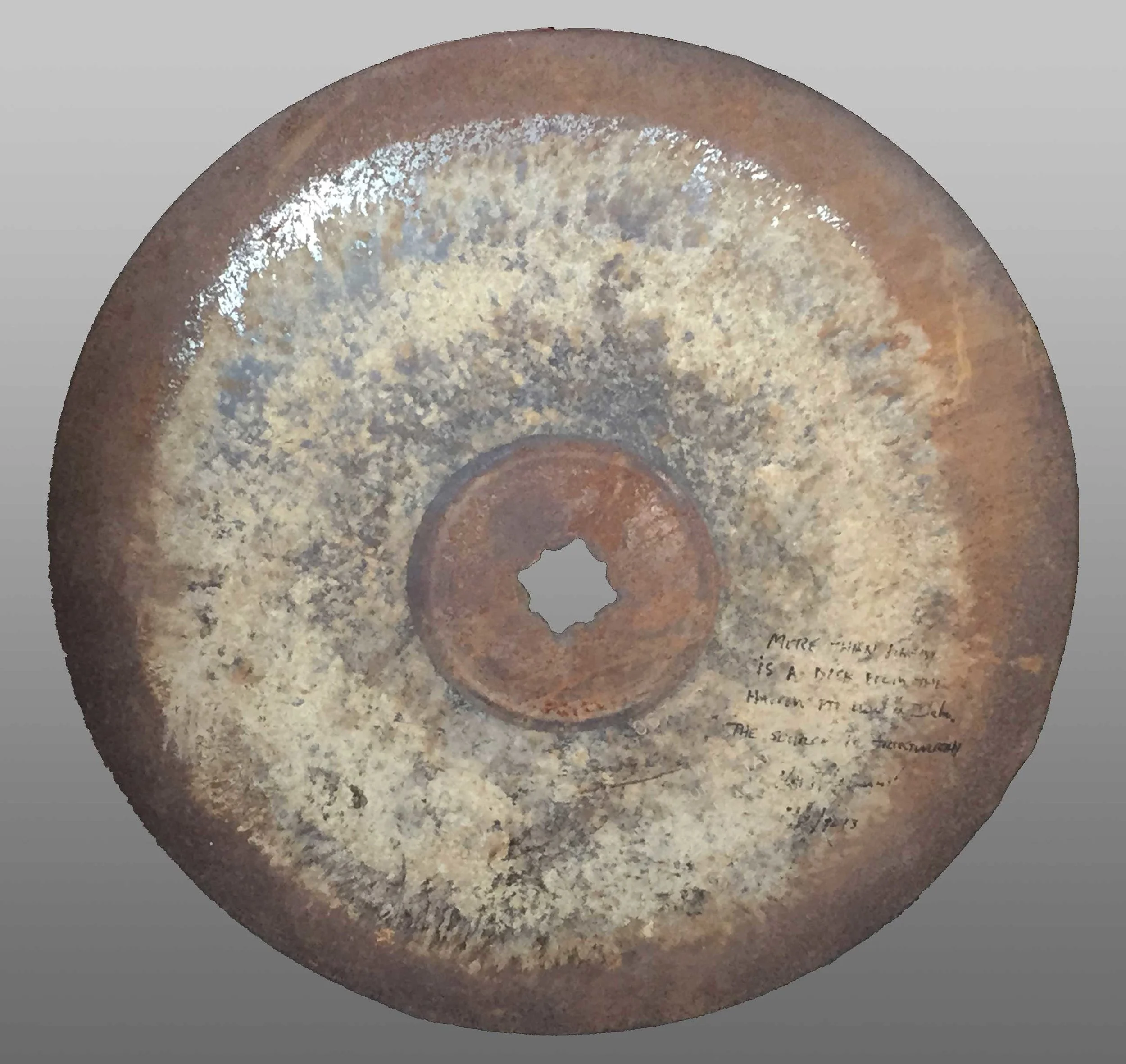 The writing on the right side of the harrow disk was put there in 2015 by Dr. Farnsworth's son, Kent, authenticating its origin. The inscription reads, "More than likely is a disk from the harrow PTF used in Utah. The source is trustworthy - Kent Farnsworth"