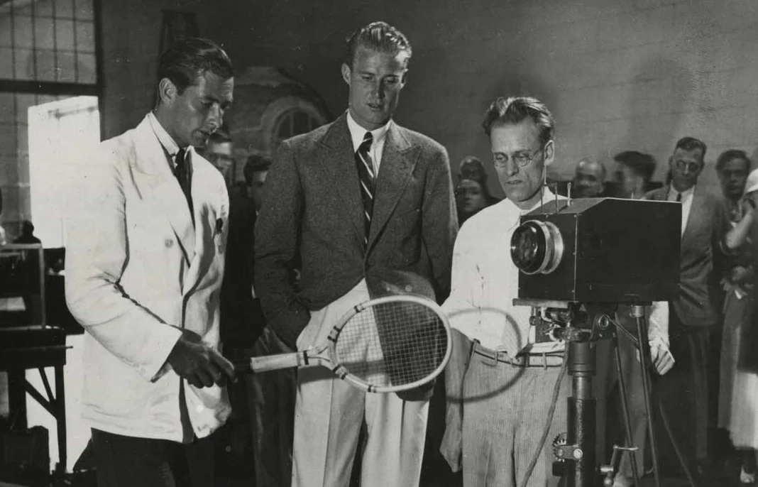 In this rare photograph from 1934, Farnsworth (on the right behind the camera) shows the strain of keeping the demonstration television system operational while programing enough material to televise for the entire 10-day run of the exhibition.