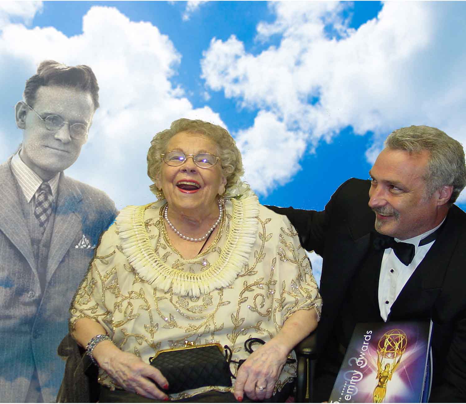 Curator, Phil Savenick, poses with Pem Farnsworth at the 2003 Emmy Awards. They're joined by the ghost of her late husband, Philo.