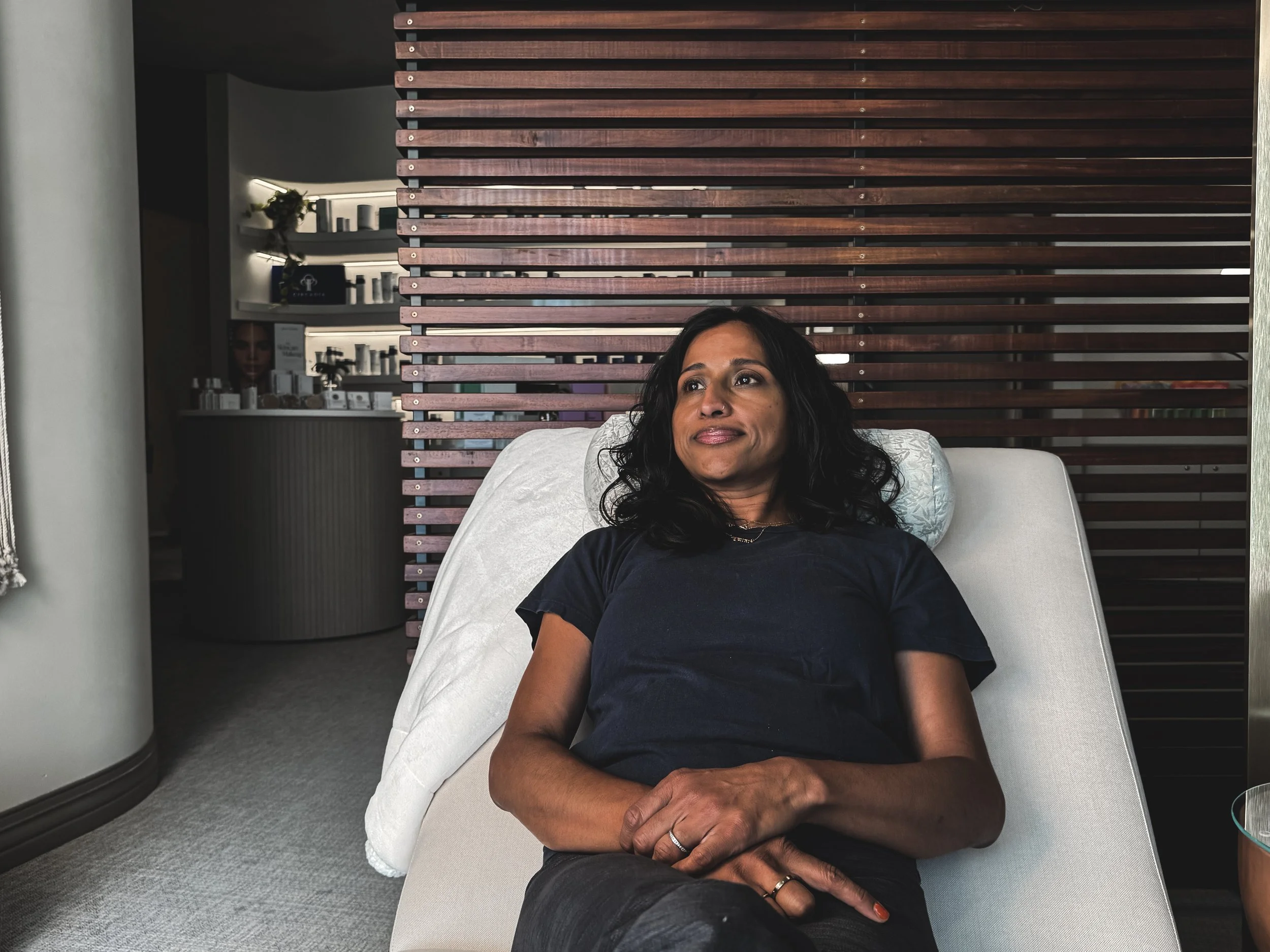 Woman relaxing in meditation garden at Jalan Facial Spa Greenwood Village
