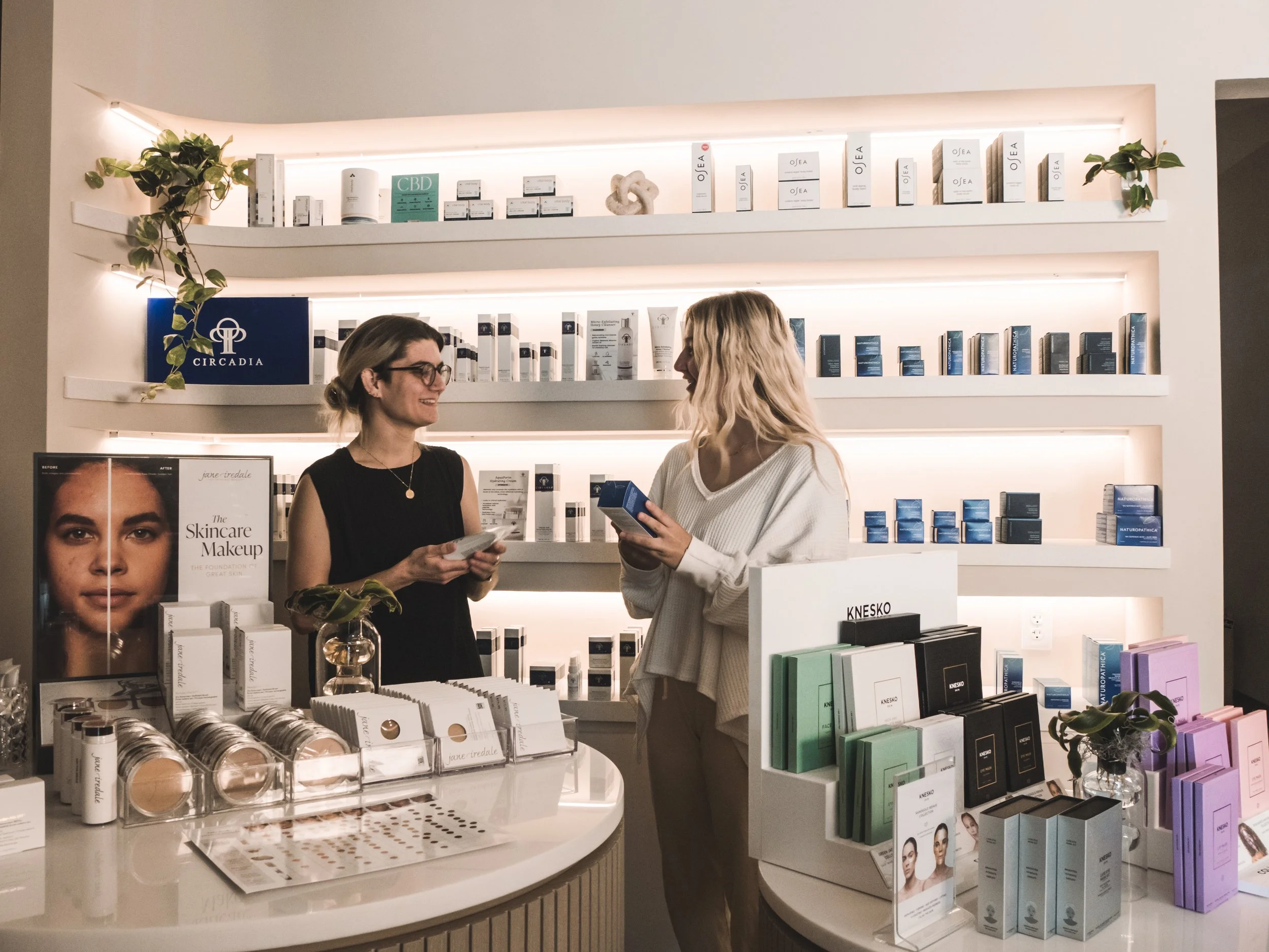 Two women shopping skincare products at Jalan Facial Spa Greenwood Village