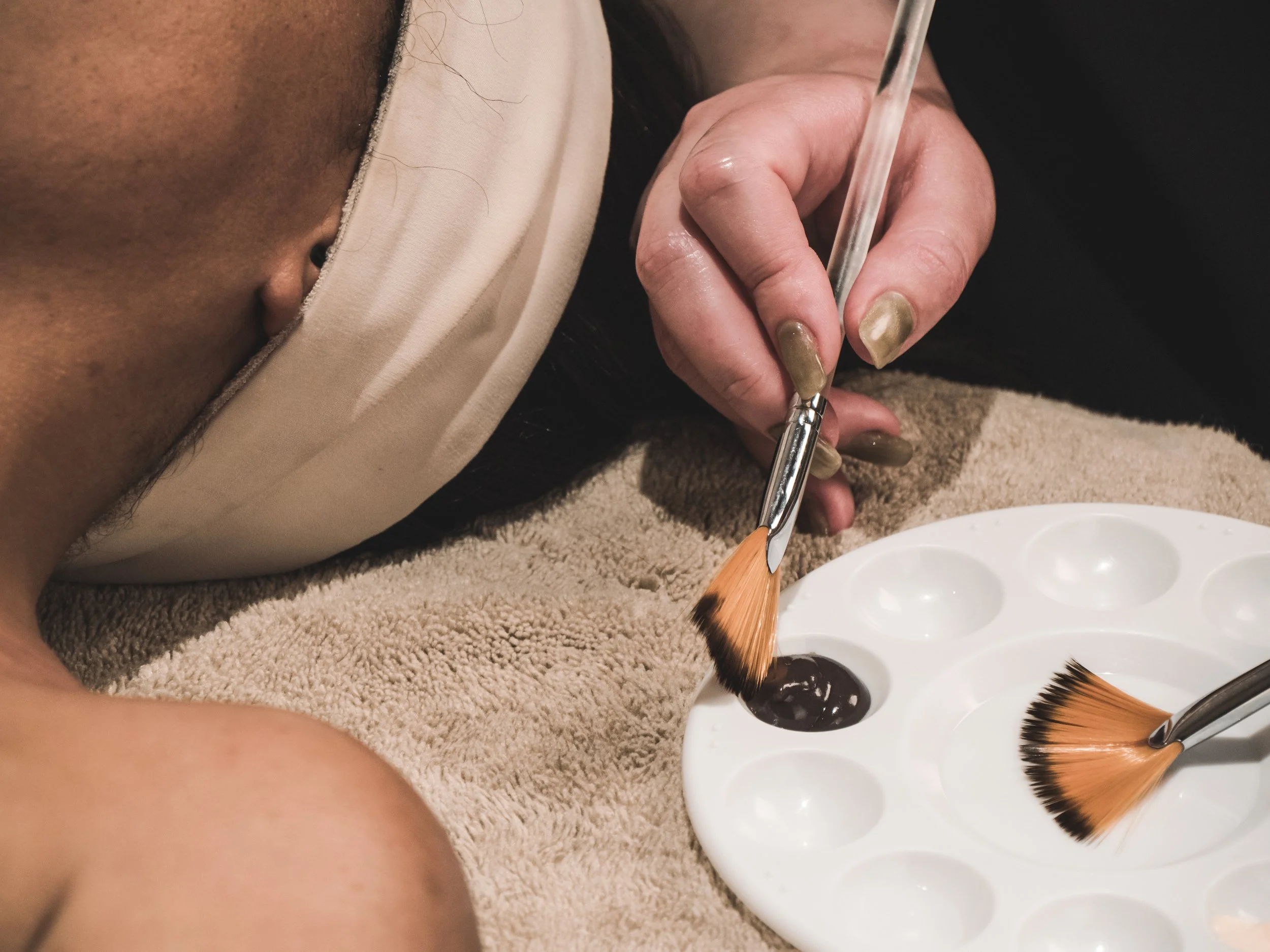Esthetician at Jalan Facial Spa prepares serums for Signature Facial treatment Greenwood Village