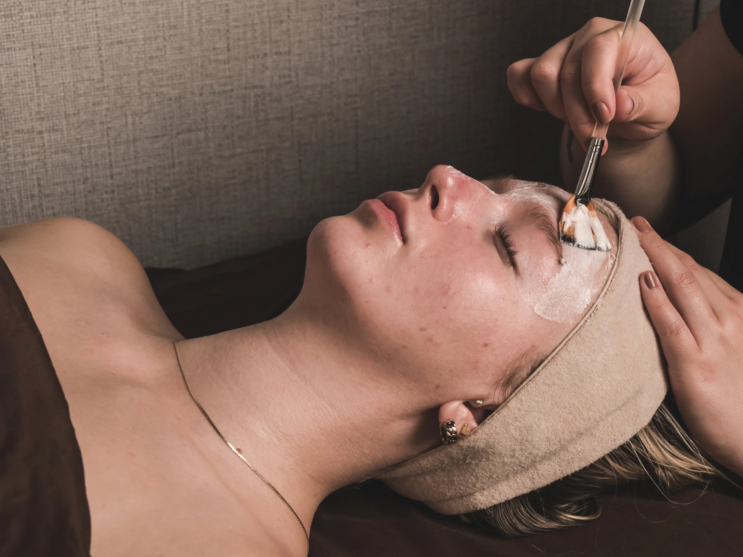 Isabell receives facial treatment with brush strokes of cleanser from esthetician at Jalan Facial Spa Denver Colorado