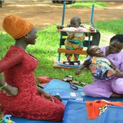 During one of the many community outreaches, a mother of a child with cerebral palsy looks on as her child receives free therapy services.
 #africanchildren #childrenareablessing #specialneeds
