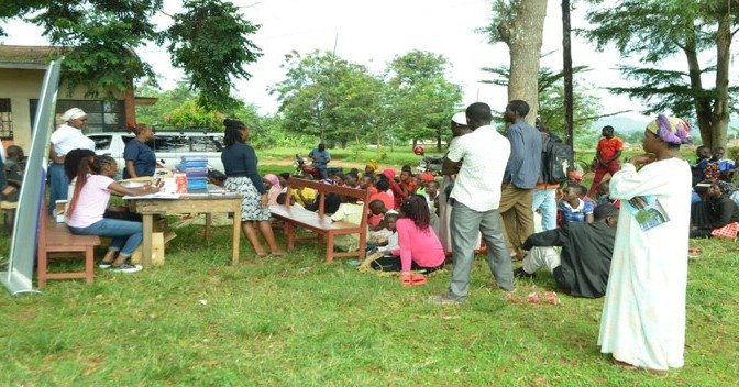 Family members of disabled children are educated before medications are given out at a recent community-outreach.  Basic medication can be hard to come by in Uganda and thanks to your donations, families are better able to care for their children. #d