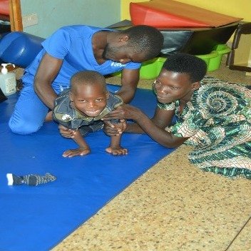 Alex, a therapist at Home of Hope helps instruct a caregiver on what exercises to do with her child at Home.  Physical therapy is a very tangible way of showing love to disabled children.

www.homeofhopeministries.org