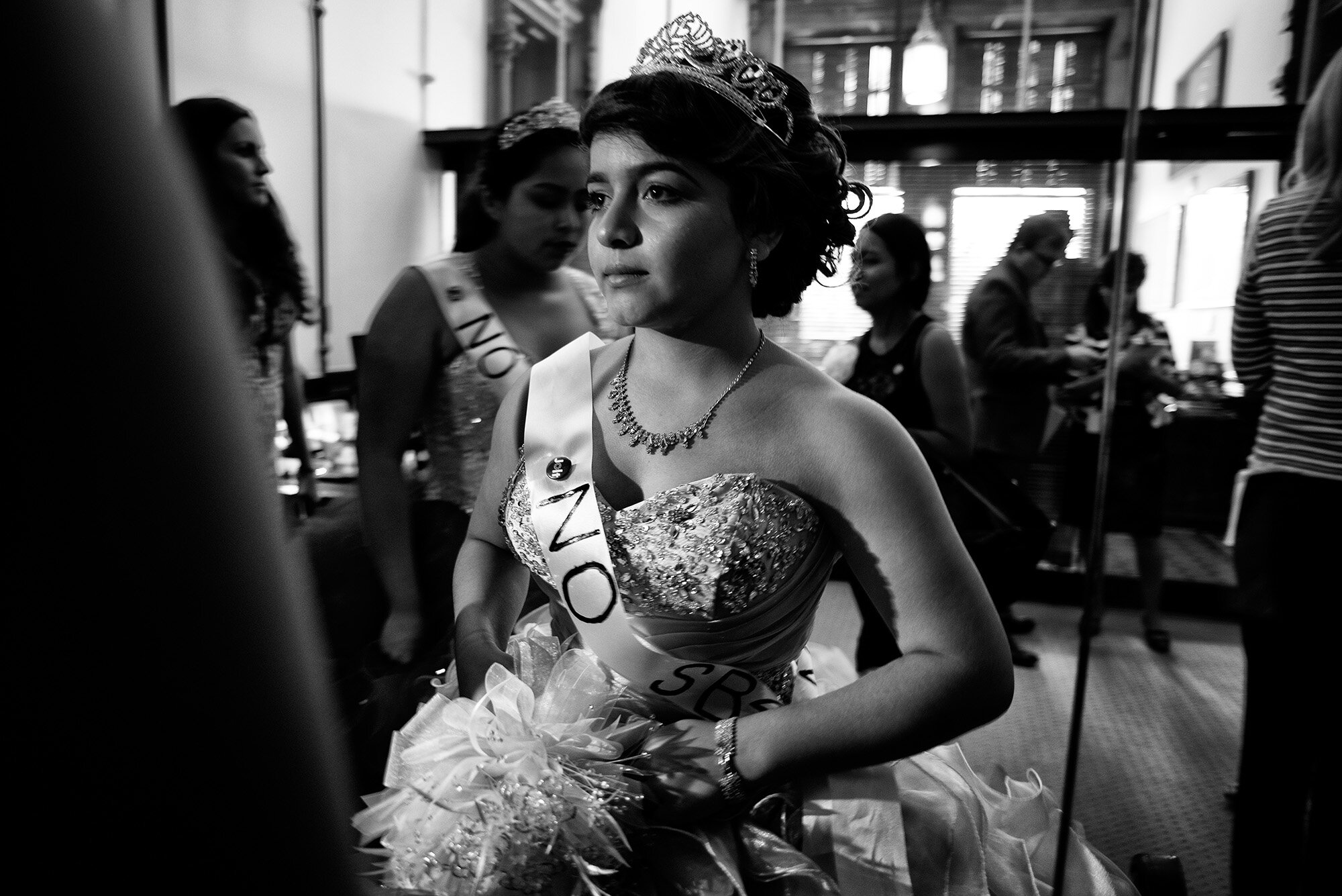  Jennifer Ramirez wears her quinceañera dress with a ‘NO SB4’ sash and stands outside the office of Texas Lt Governor Dan Patrick.  