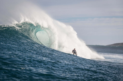 Ethan Ewing riding a big surfboard in big waves