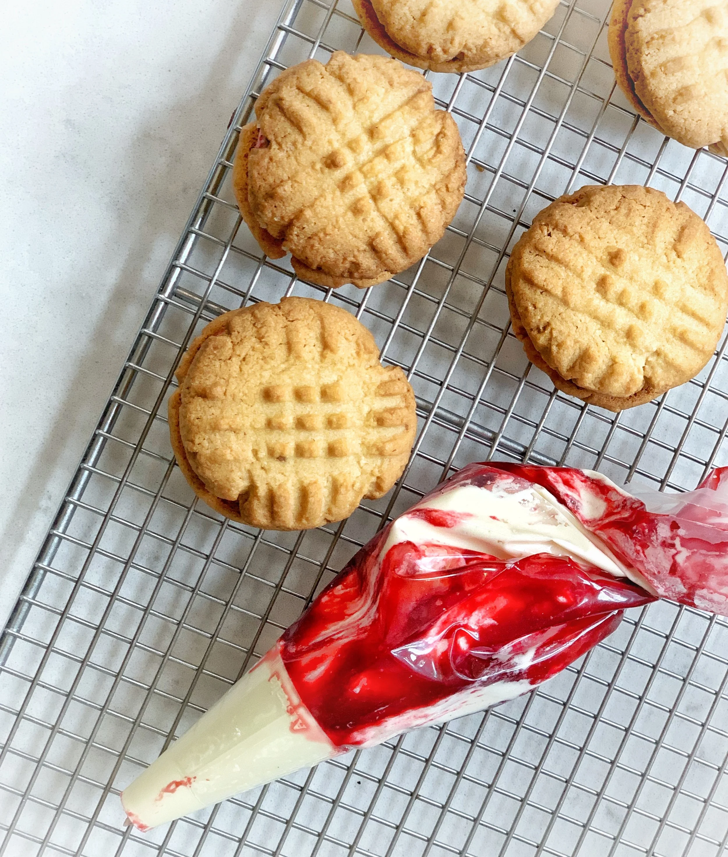 Piping the jam and buttercream