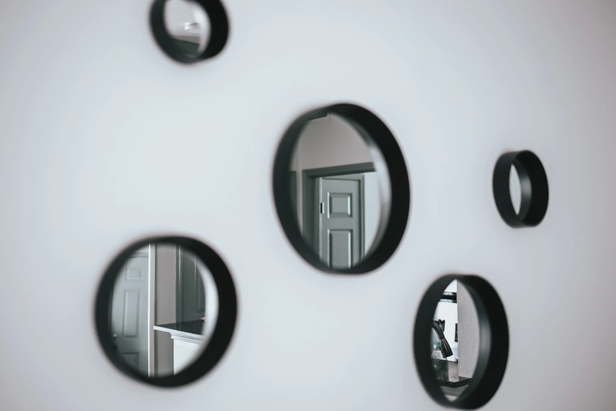 these mirrors are above the bench. I love incorporating mirrors on my walls because they bring in even more natural light. This space would also look great with one big round mirror above it.