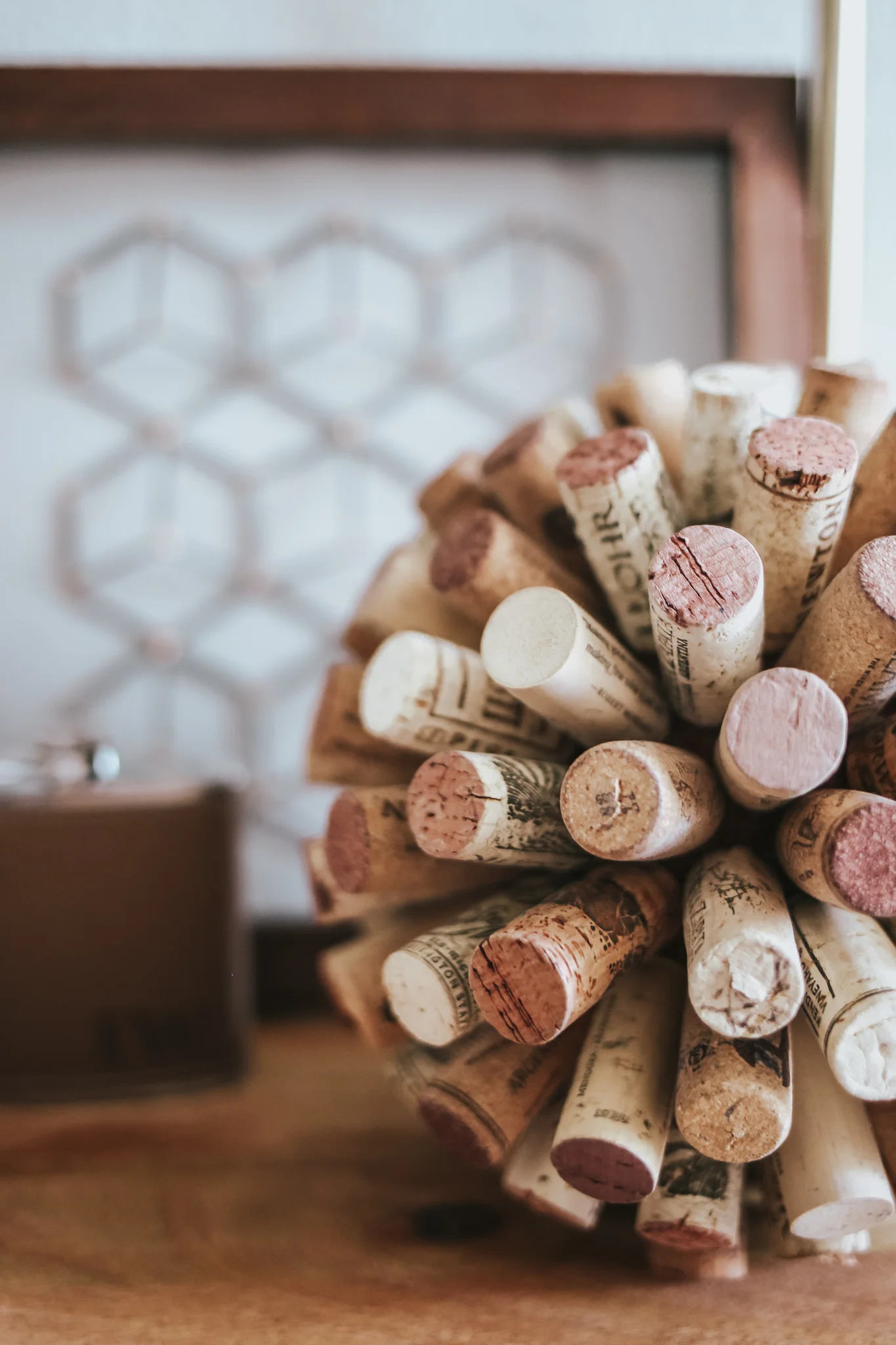 To make this DIY cork ball: 1) Get a 3 inch styrofoam ball from craft store 2) paint brown, allow to dry 3) hot glue corks as close as possible, until ball is covered (FYI it takes forever)!