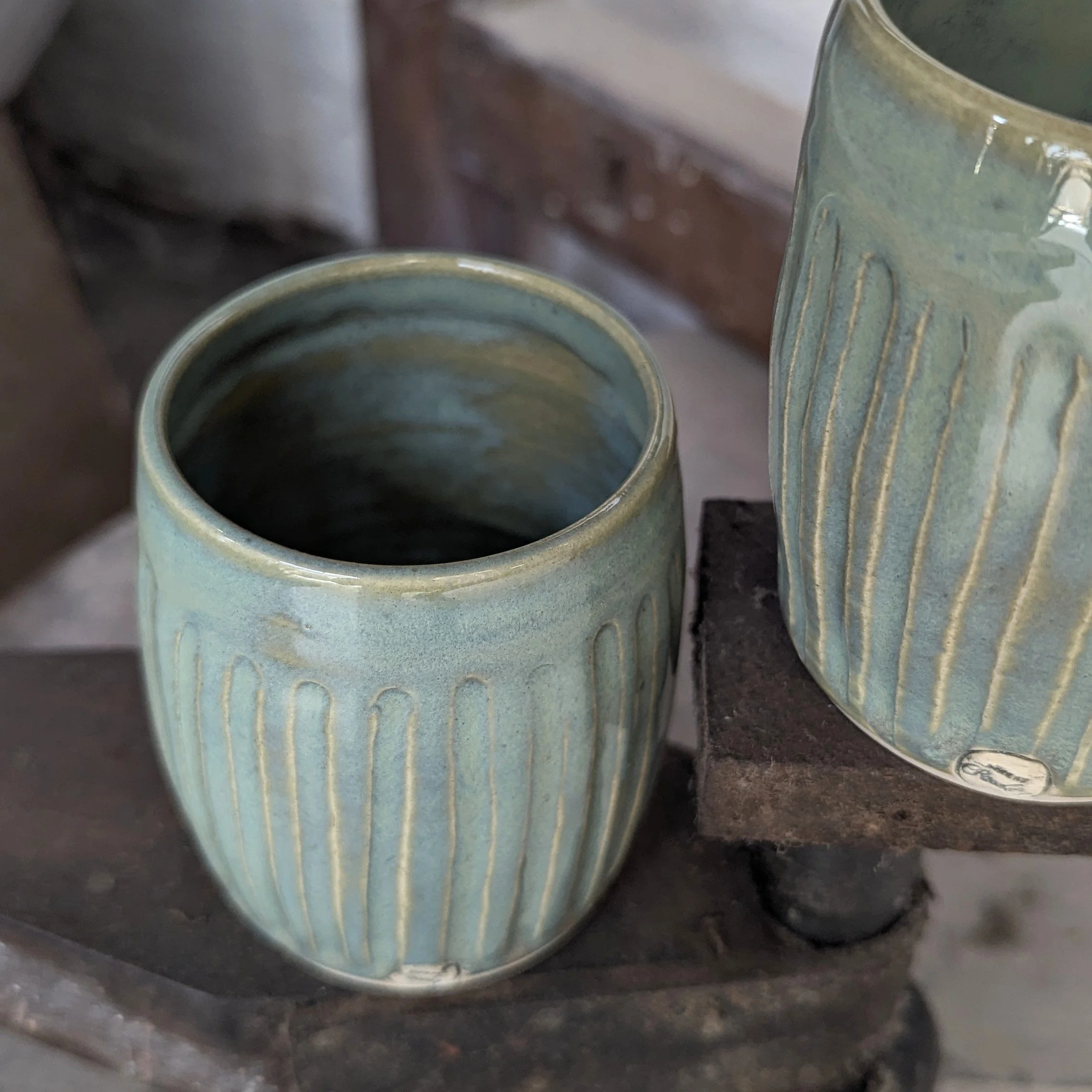 Carved pottery tumblers
