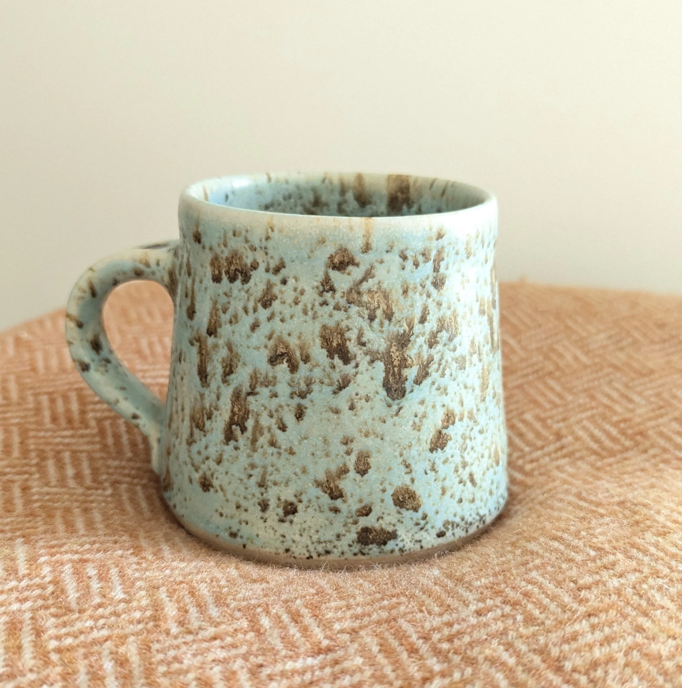 Pottery mug turquoise speckled
