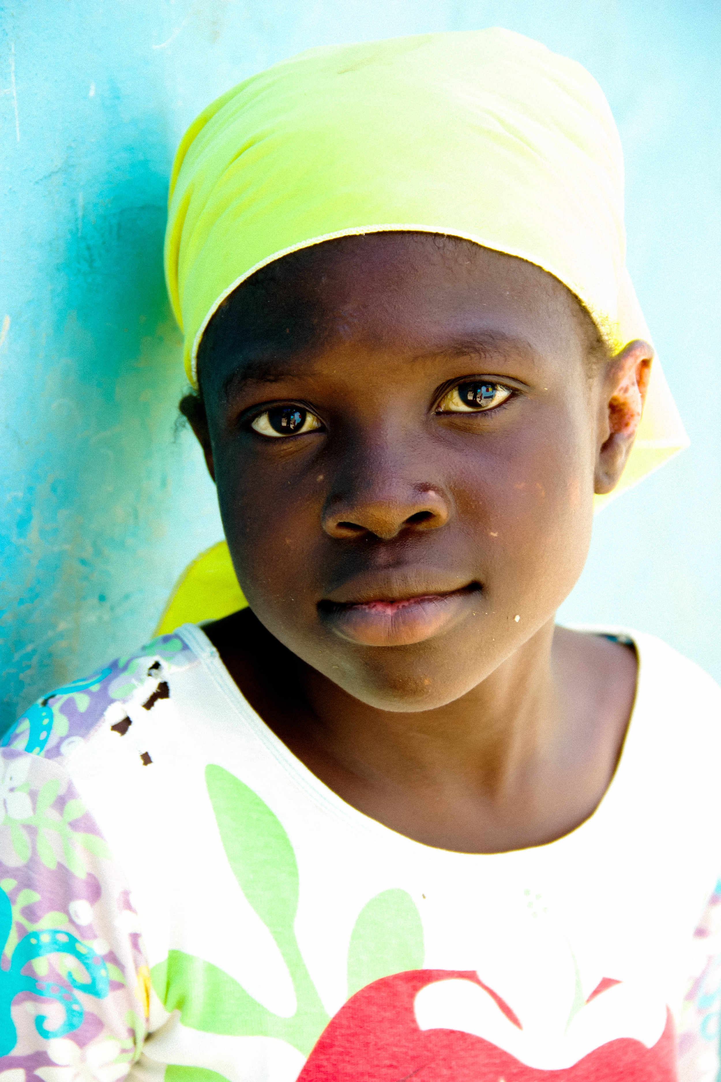 JacobGrantPhotography_Portraits, Haitian Child against Blue Wall