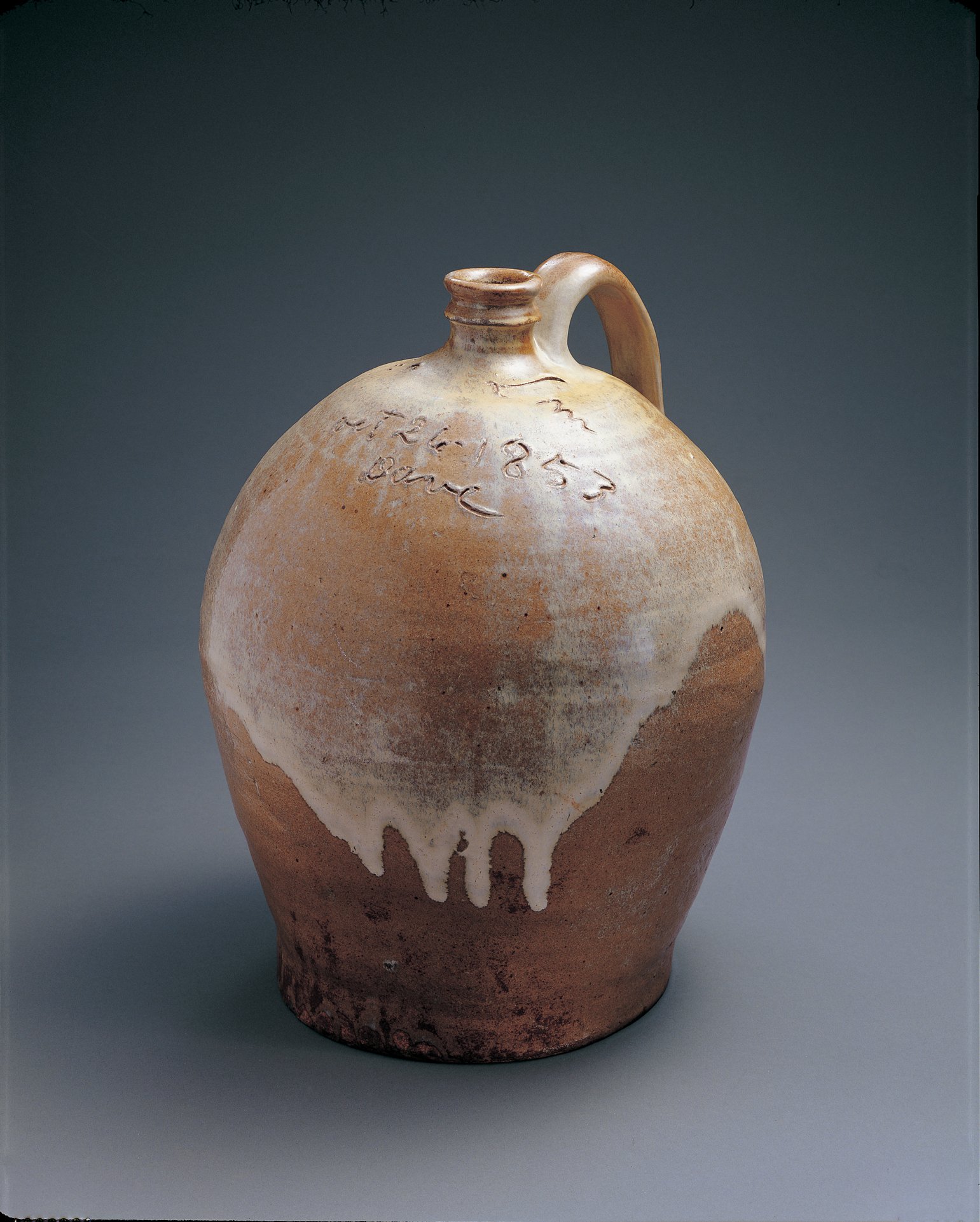  David Drake (c. 1800–c. 1870), Lewis J. Miles, Stony Bluff Plantation Pottery,  Jug , 1853, alkaline-glazed stoneware, 14 1/2 x 12 x 11 1/2 inches.&nbsp;Collection American Folk Art Museum, New York. Gift of Sally and Paul Hawkins, 1999.18.1. Photo 