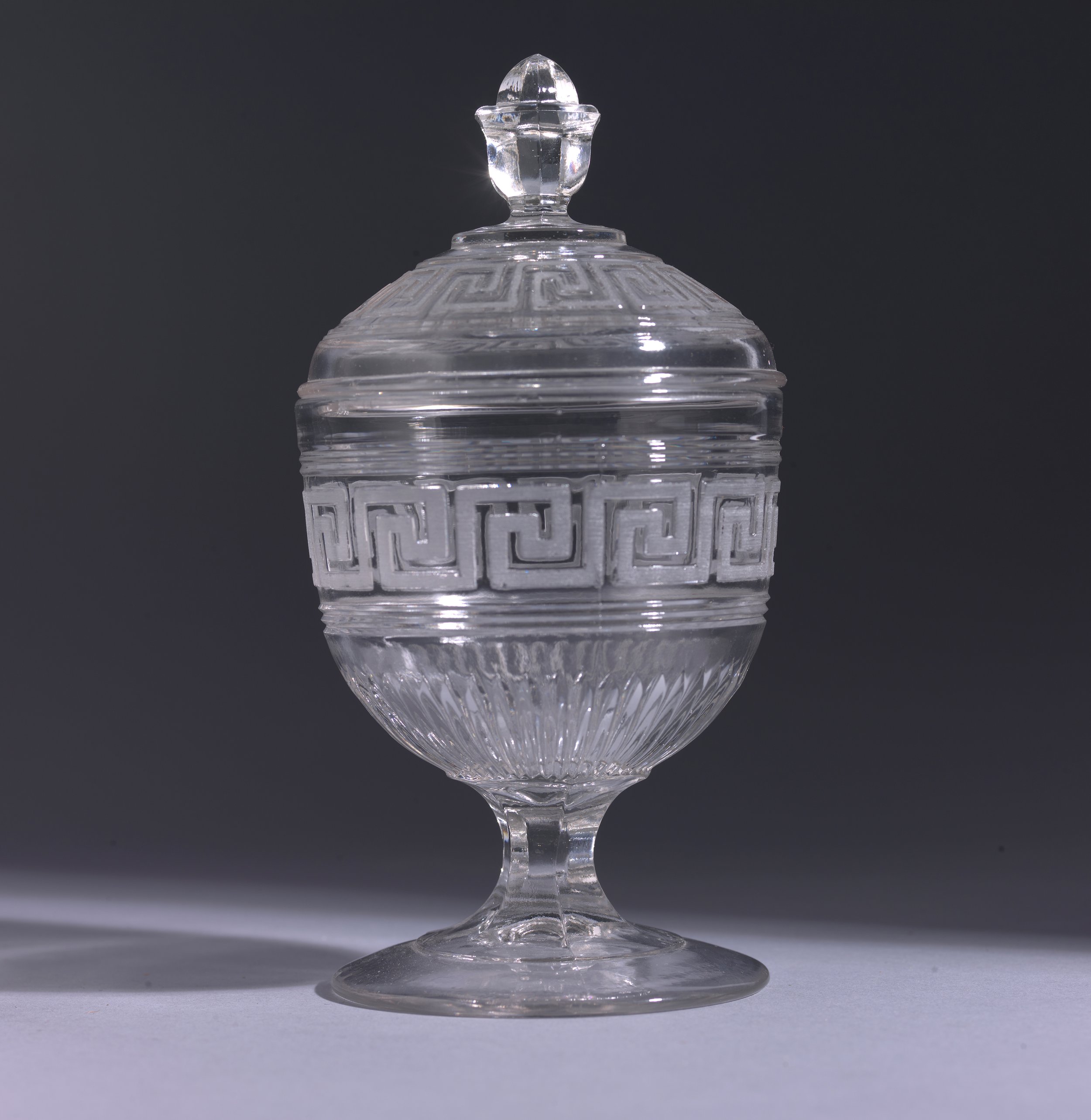  Possibly Portland Glass Company (United States, 1863–1873),  Covered Sugar , 1860–1870, clear pressed glass, 8 1/2 x 4 7/16 inches. Portland Museum of Art, Maine. Gift of John, Clifford, and Douglas Carver in memory of Mrs. Clifford N. Carver, 1973.