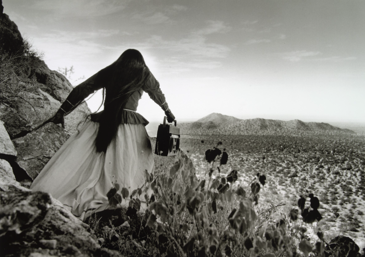  Graciela Iturbide  Mexico, born 1942   Mujer Ángel (Angel Woman), Sonora Desert , 1980 gelatin silver print, 16 x 22 3/8 inches Promised Gift from the Judy Glickman Lauder Collection, 4.2008.3 