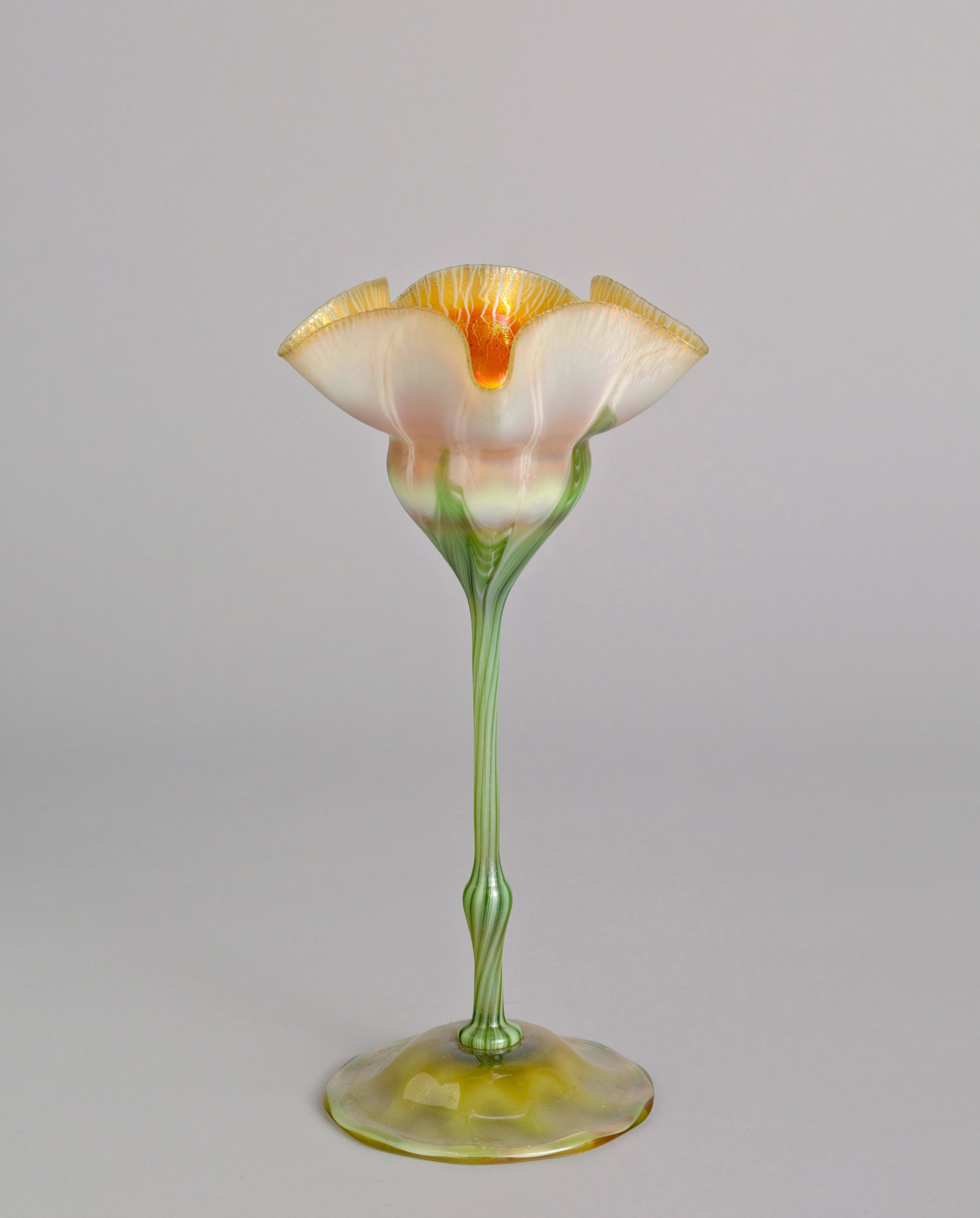   Tiffany Furnaces  United States, 1902–1932  Jonquil Vase , 1903–1917 blown Favrile glass, 9 5/8 x 5 x 5 inches Bequest of Sylvia D. Greenberg, 2002.11.248 