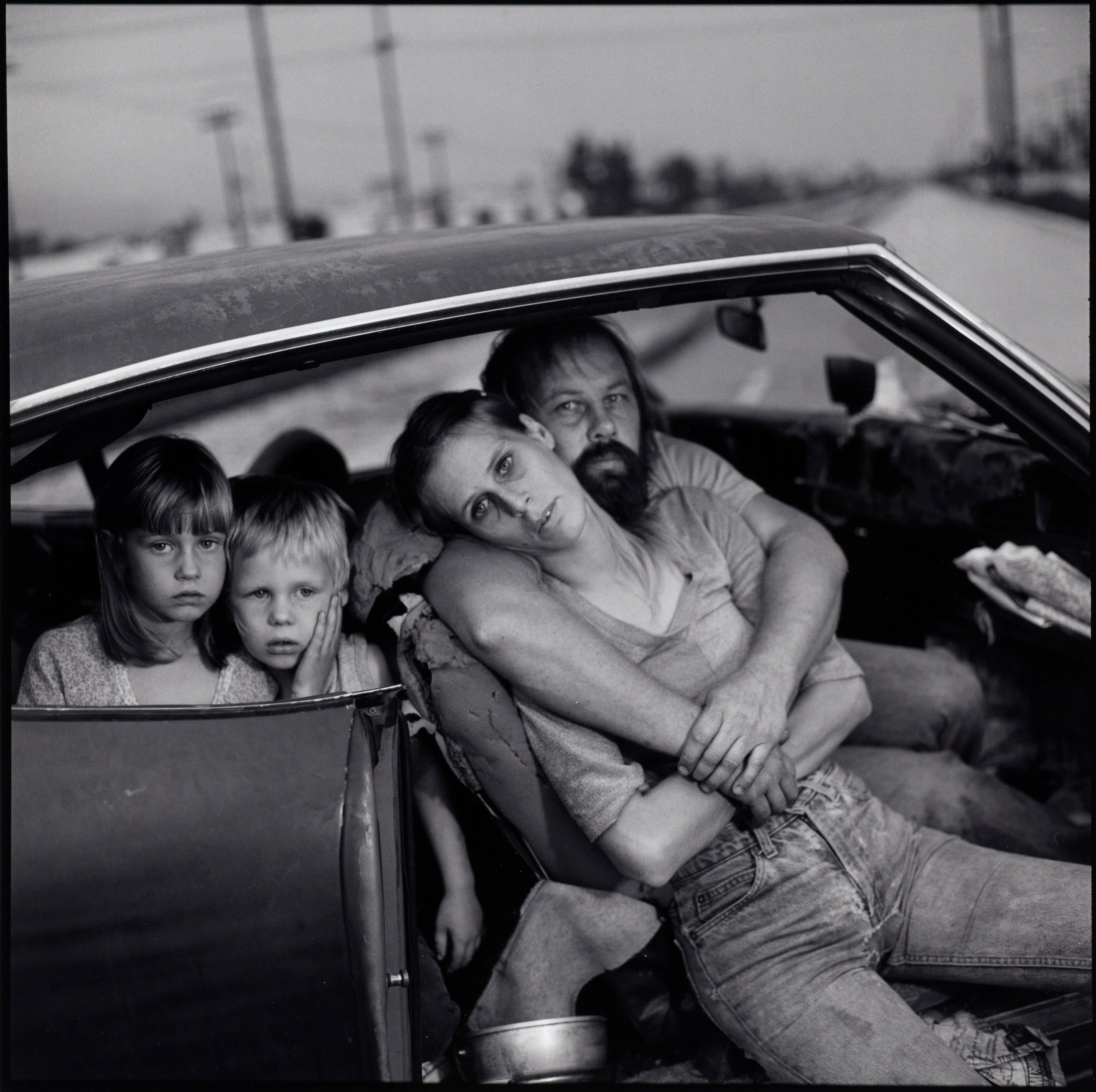   Mary Ellen Mark  United States, 1940–2015  The Damm Family in Their Car, Los Angeles, California , 1987  gelatin silver print, 10 3/16 x 10 1/4 inches Gift of the artist for the Ernst Haas Memorial Collection, 1998.74 