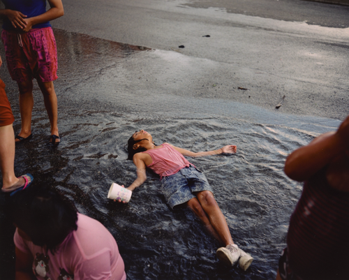   Paul D'Amato  United States, born 1956   Girl in Rain, Chicago , 1991 archival inkjet print, 11 x 13 1/2 inches Promised Gift from the Judy Glickman Lauder Collection, 1.2016.7 