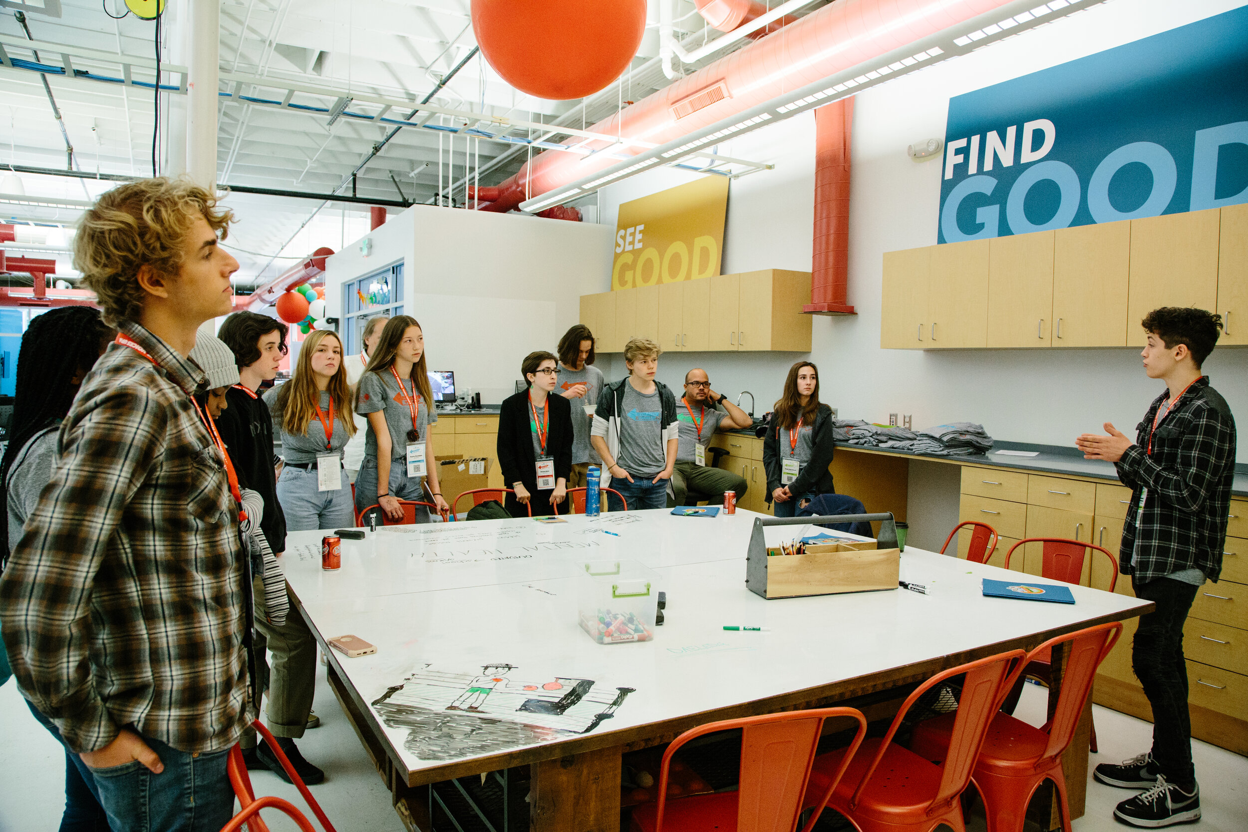  Workspace learner Nathaniel, at the far right, presents possible gun control solutions to fellow students during the Create Good session during the third and final day of the summit. 