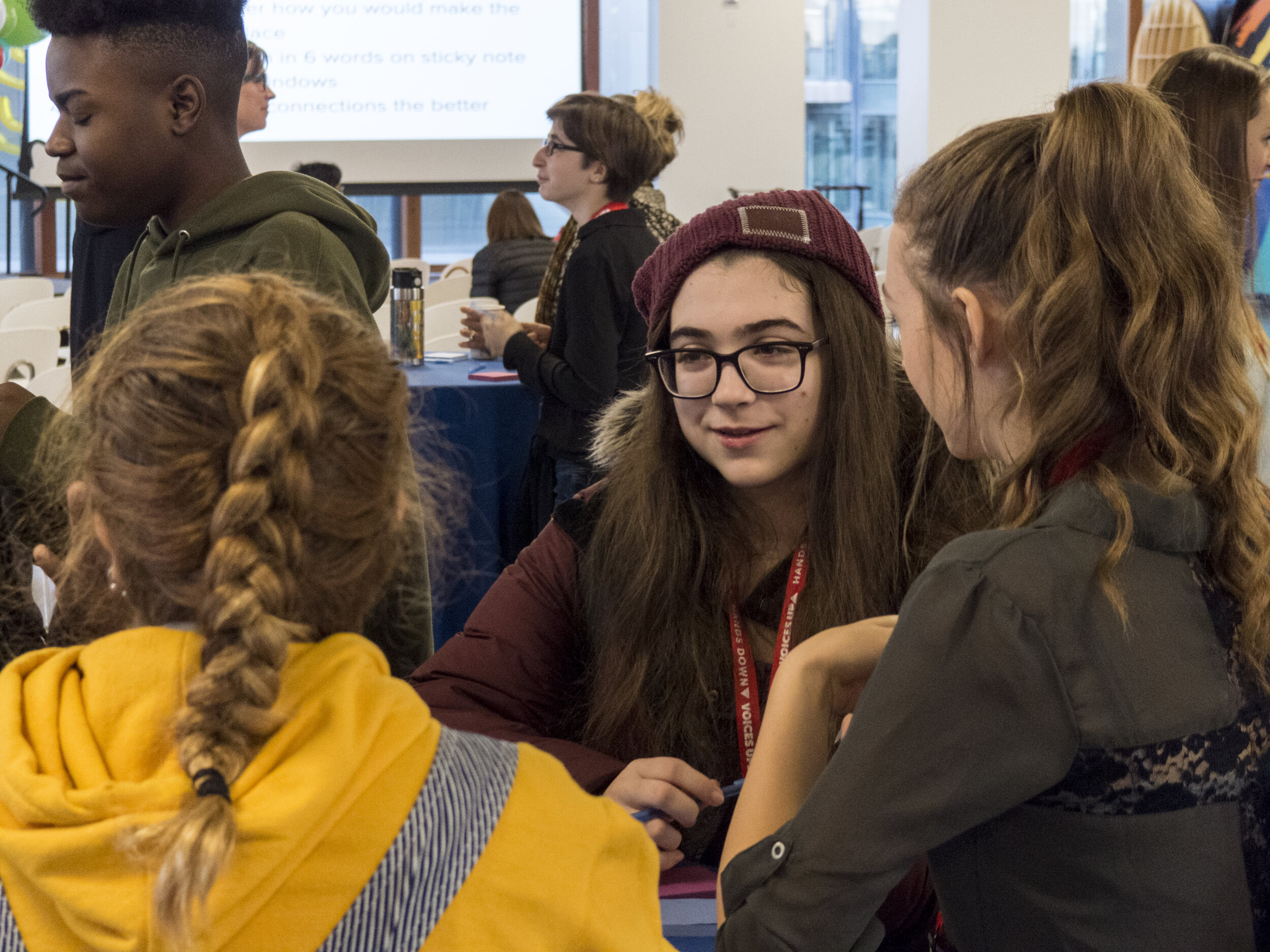  Workspace learner Sophia visits with One Stone students during a meet-and-greet session. Sophia was one of several students who chose to address the issue of false imprisonment during the final day of Hands Down, Voices Up. 