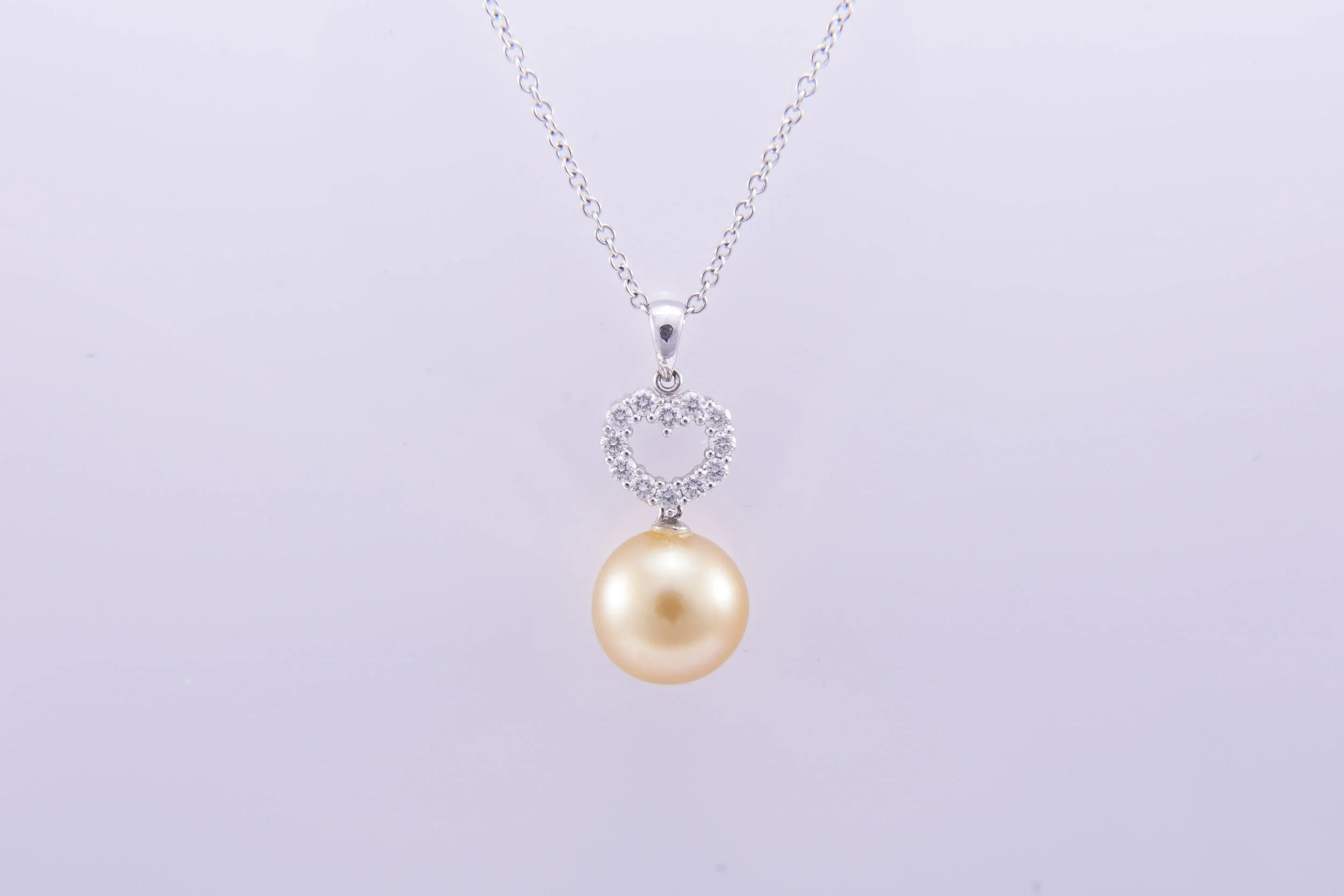 Golden South Sea Pearl Pendant with Heart Shaped Multi Diamonds 