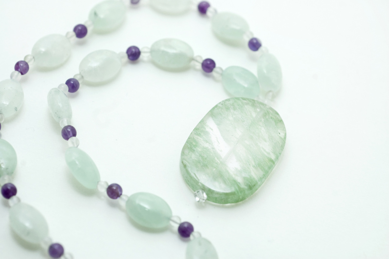  Green-dyed quartz pendant with green-dyed quartz, moonstone and amethyst  16”  $39.95 