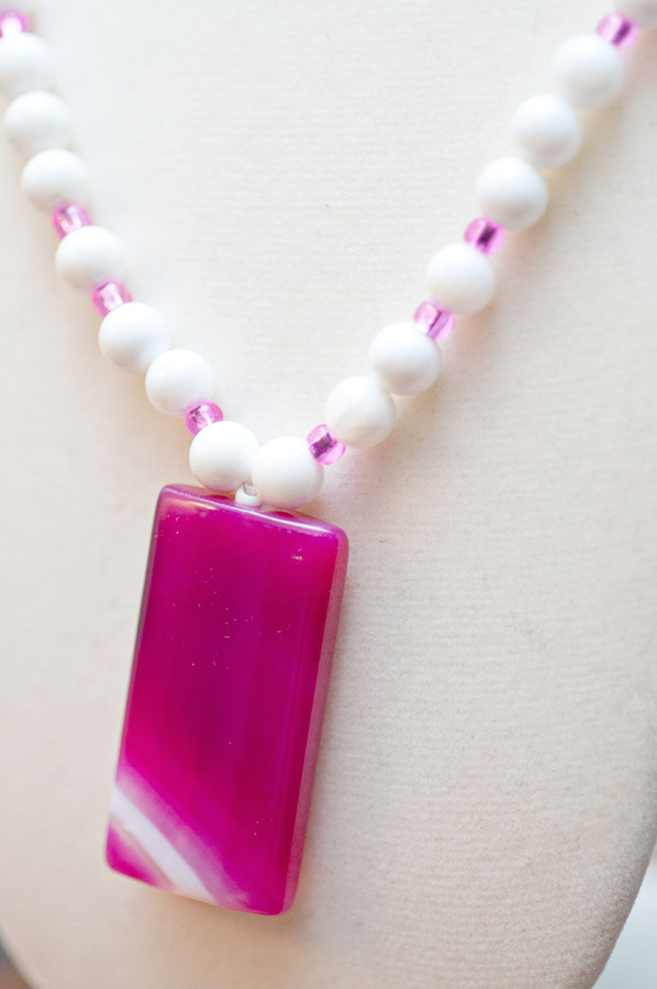  Pink-dyed quartz pendant (white stripe) and white shell  18”  $35.95 