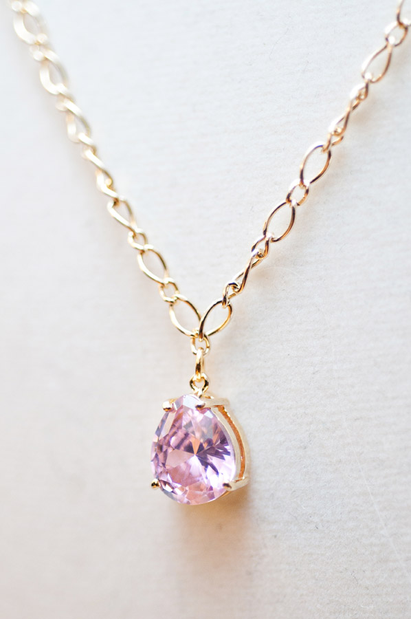  Pink cubic zirconia pendant with gold chain  16”  $14.95 