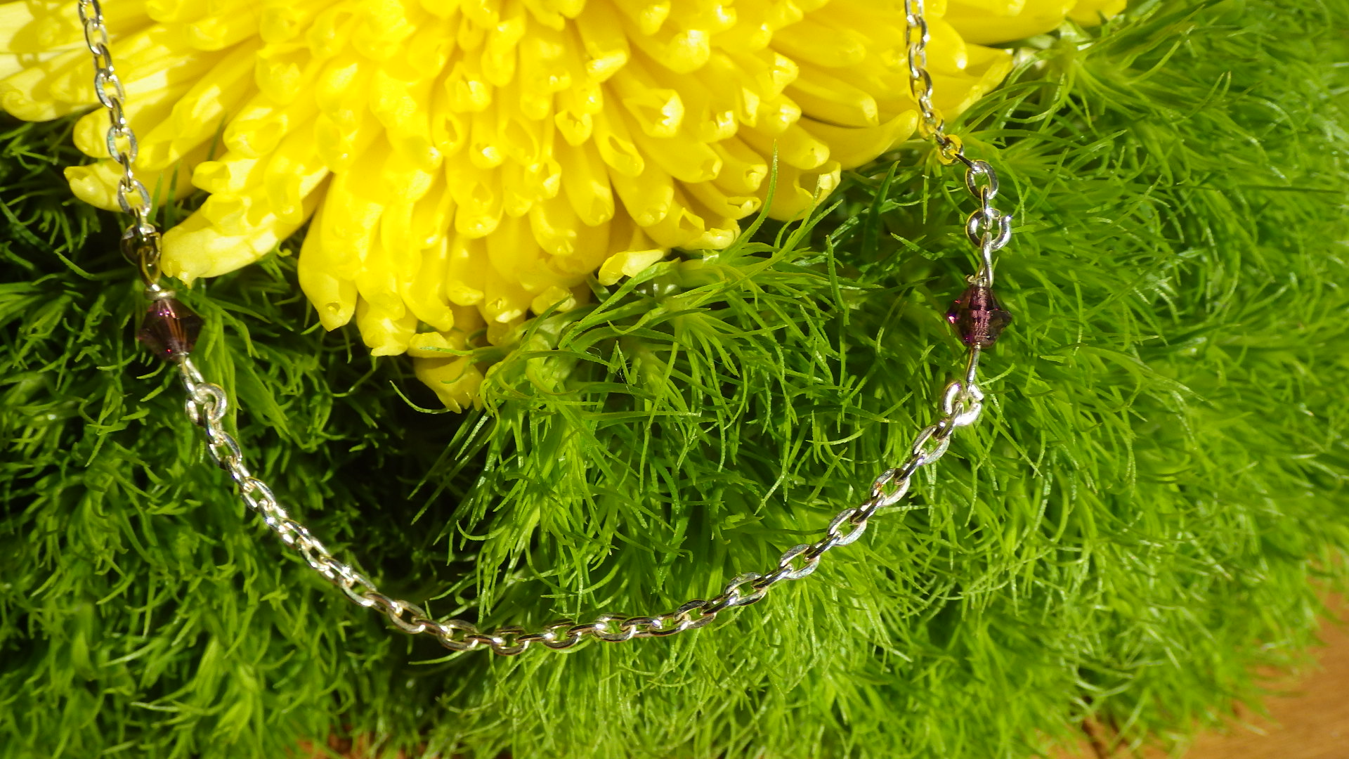  Purple Swarovski beads and silver chain  18”  $19.95 