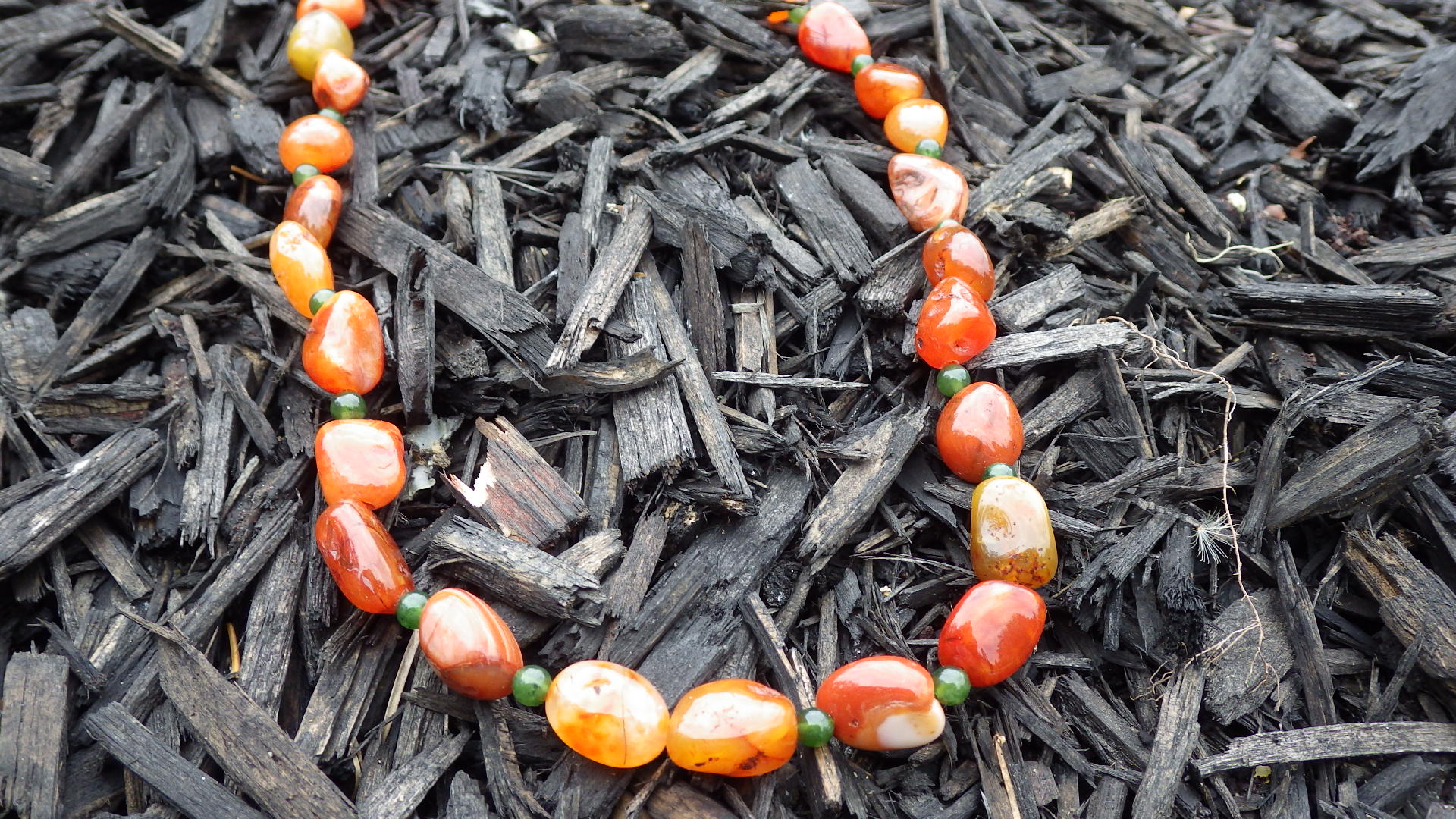  Carnelian with green accents and gold findings  18”  $32.95 