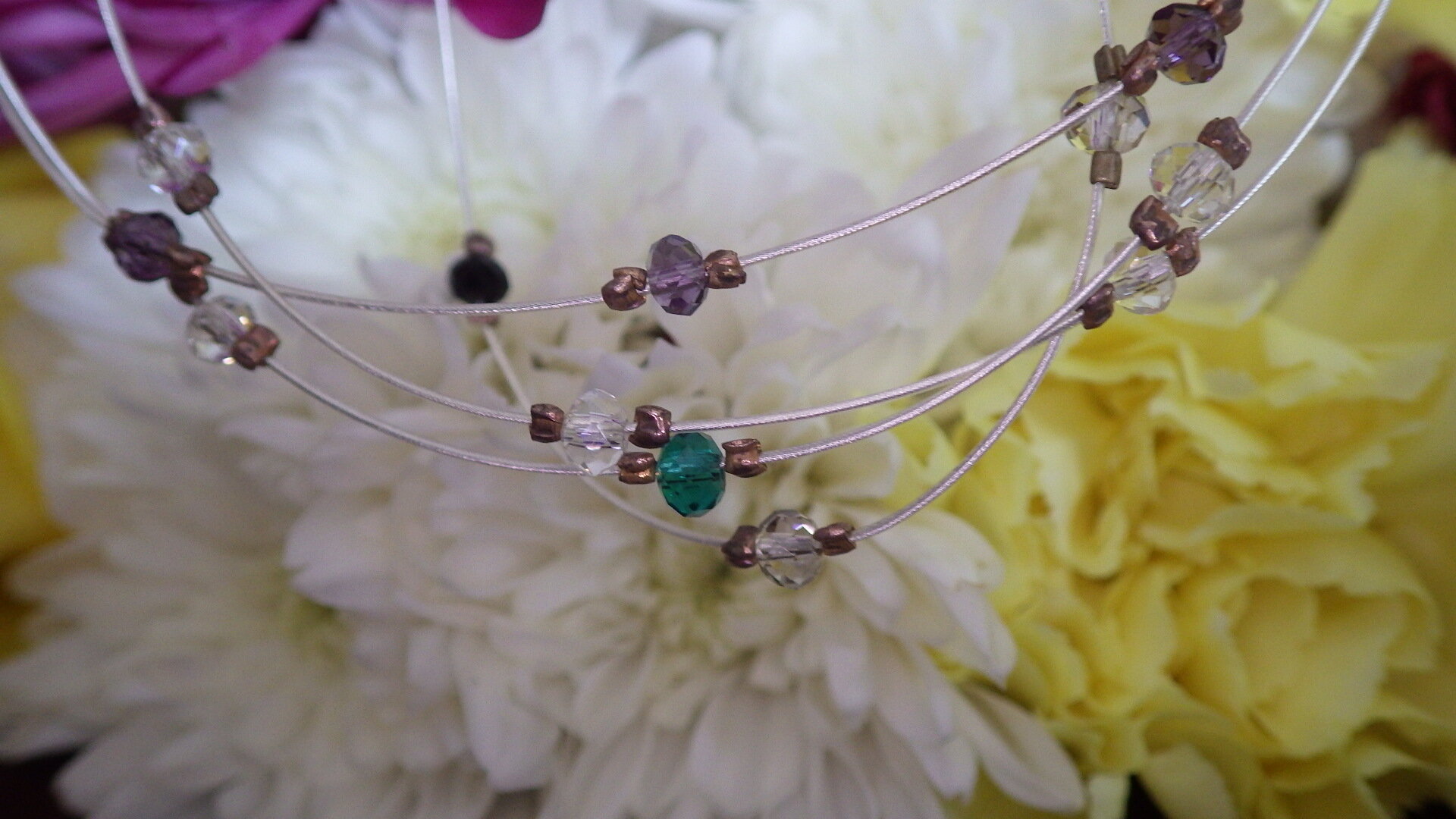  Floating purple, green, black and clear crystal with silver findings  18”  $29.95 