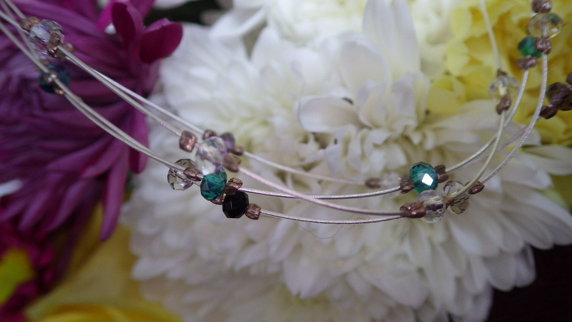  Floating purple, green, black and clear crystal with silver findings  18”  $29.95 