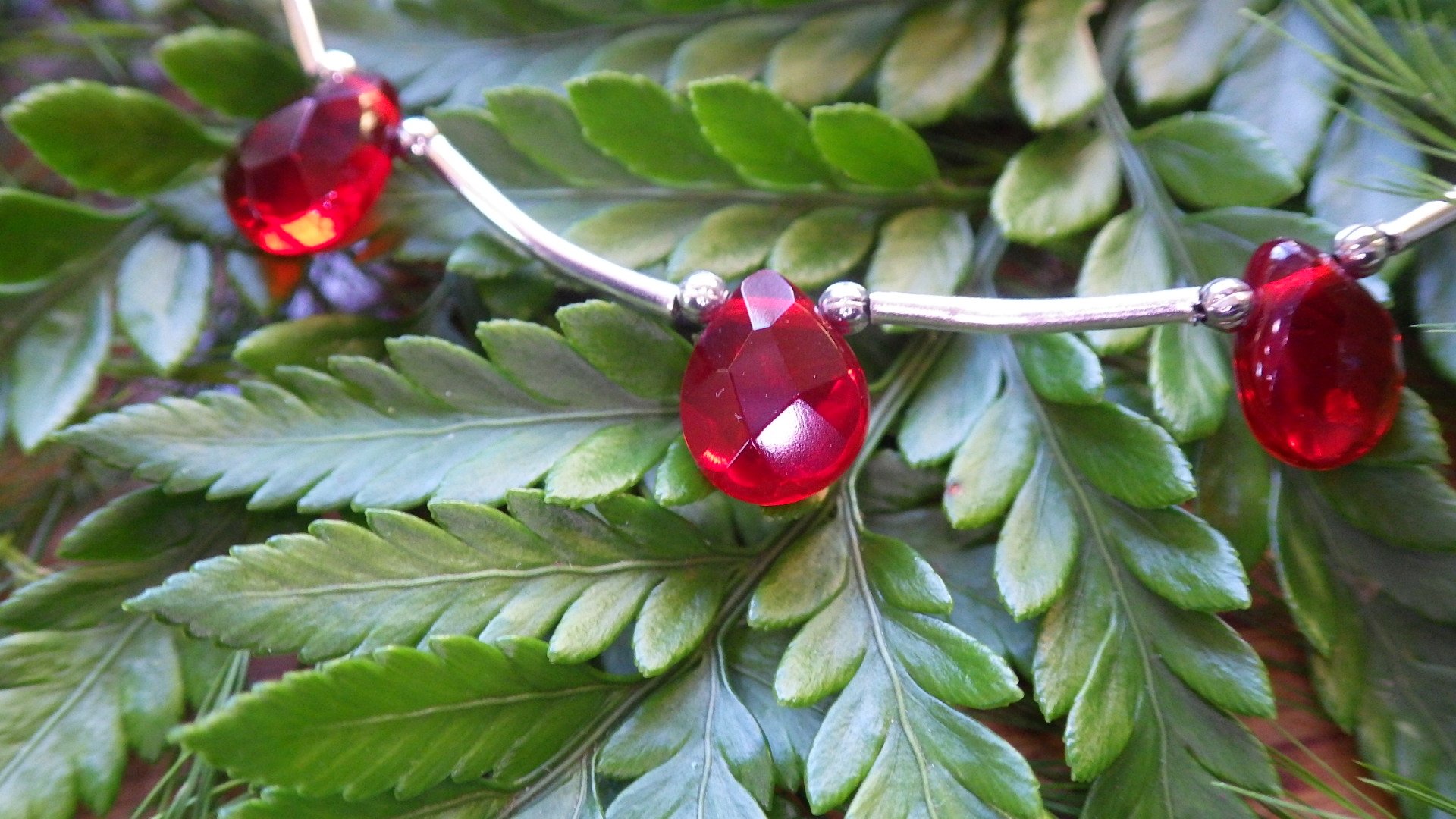  Red teardrop crystal (7 drops)  with silver spacing and chain  18”  $24.95 
