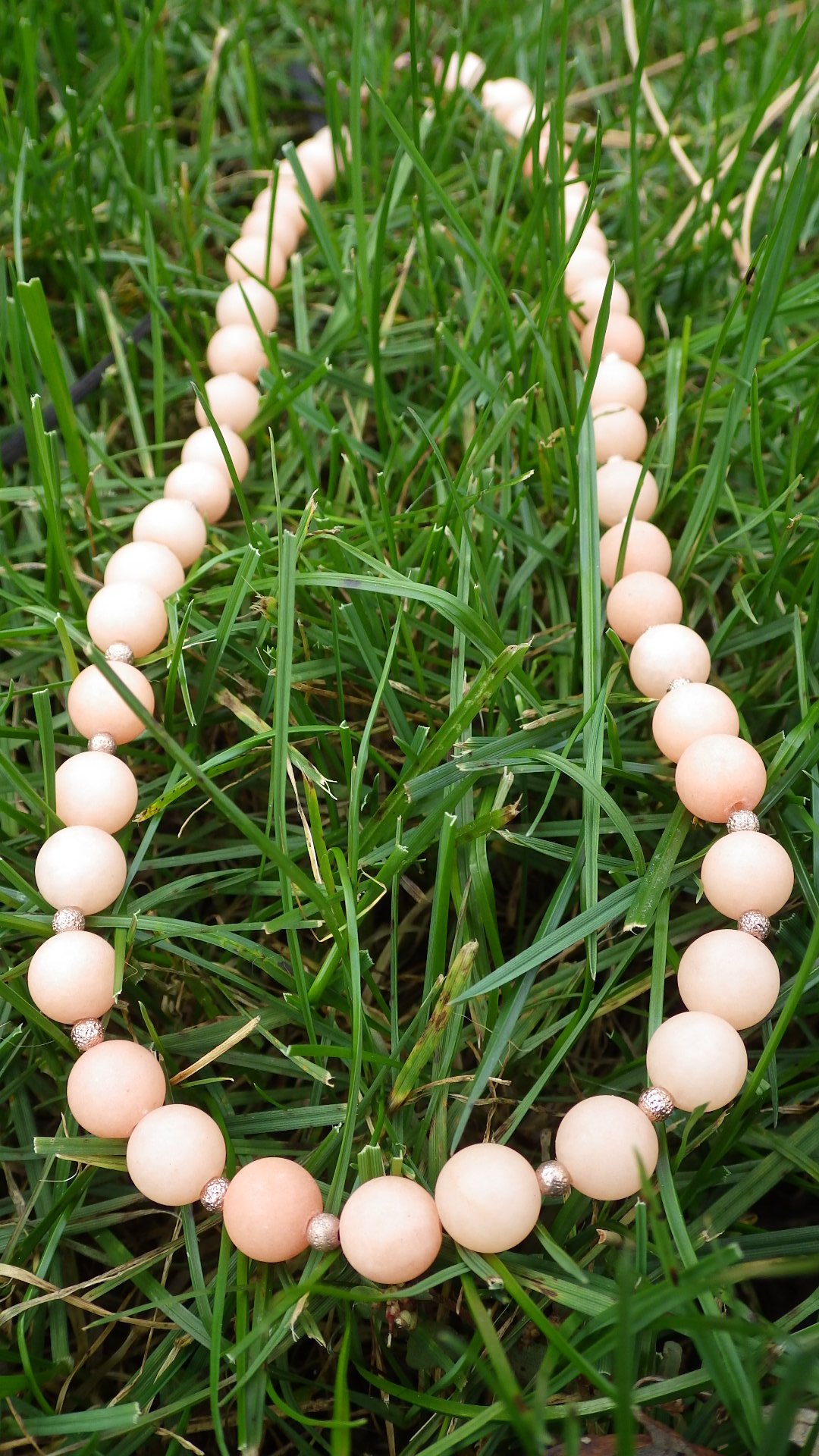  Matte peach quartz with bronze accents and bronze findings  18”  $29.95 