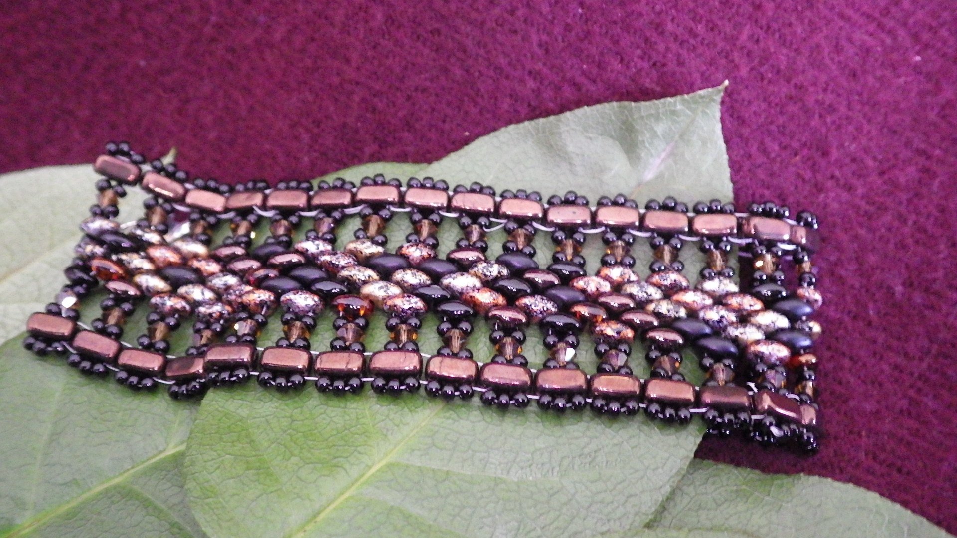  Seed bead bracelet - Brown edge, black fringe, brown pebbled inside with silver findings  9”  $45.00 