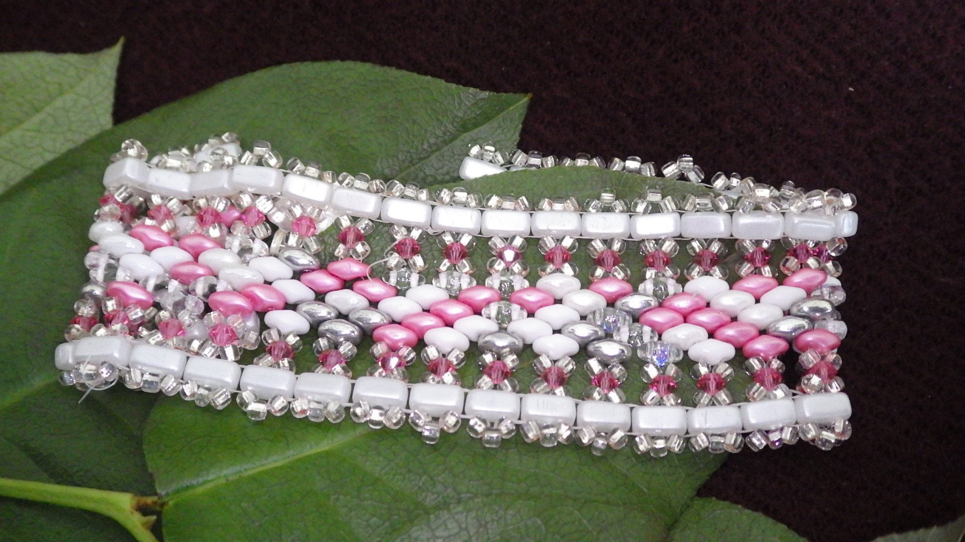  Seed bead bracelet - White edge, silver fringe, pink/white/ clear inside with silver findings  8.5”  $45.00 