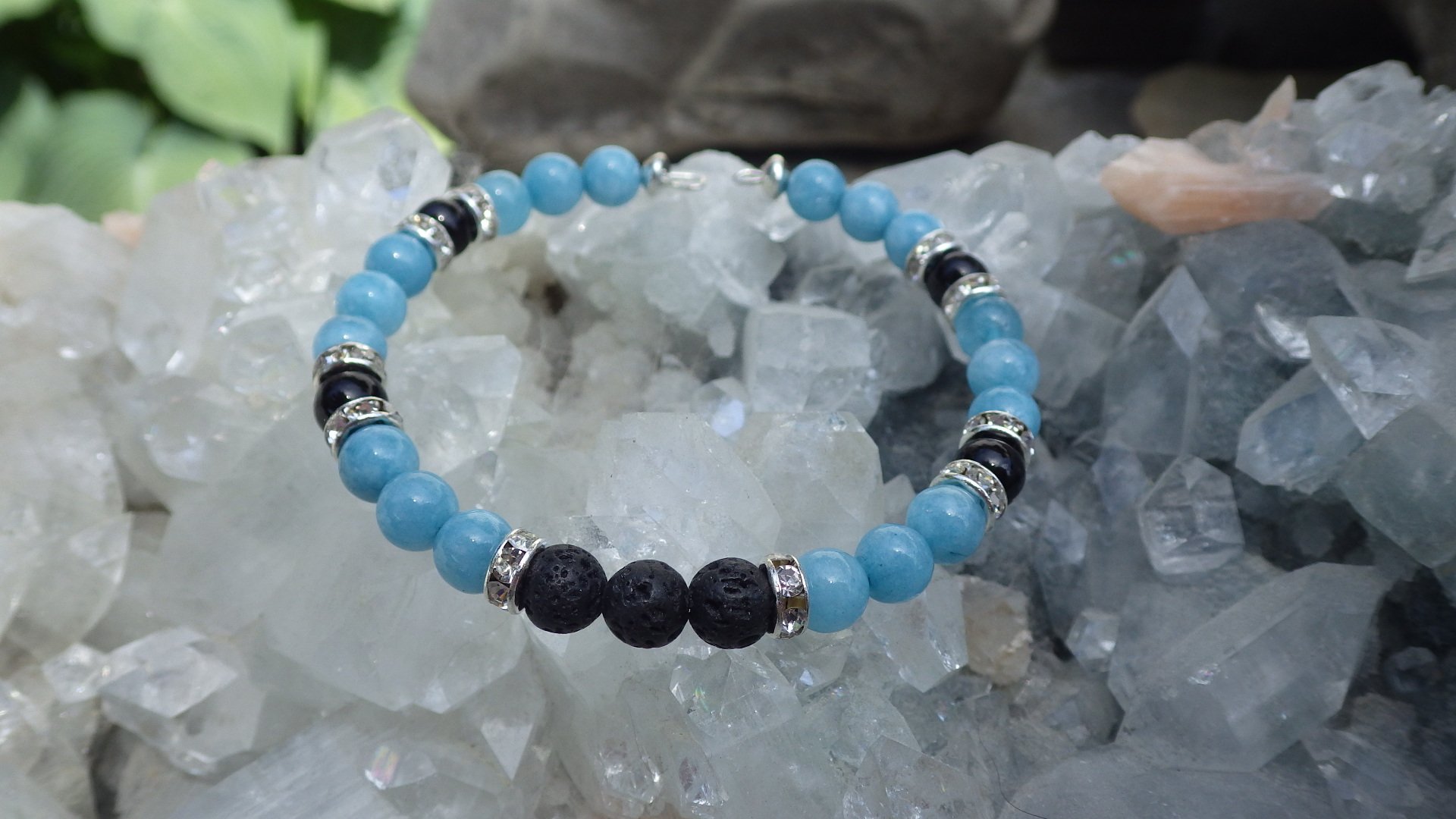  Blue and black agate with silver/crystal spacers and lava rock for essential oils. Wrap bracelet (memory wire)  $24.95 