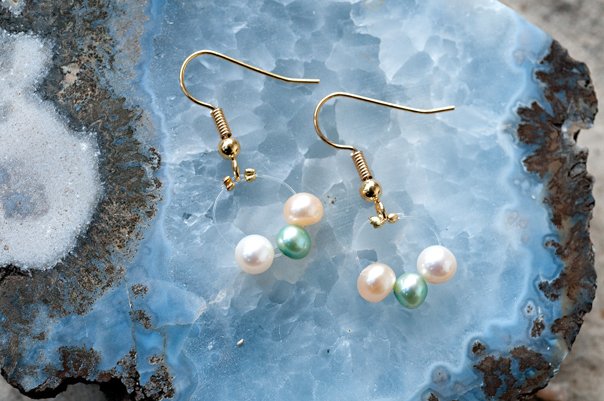  Floating white, pink and green pearls with gold findings  $12.95 