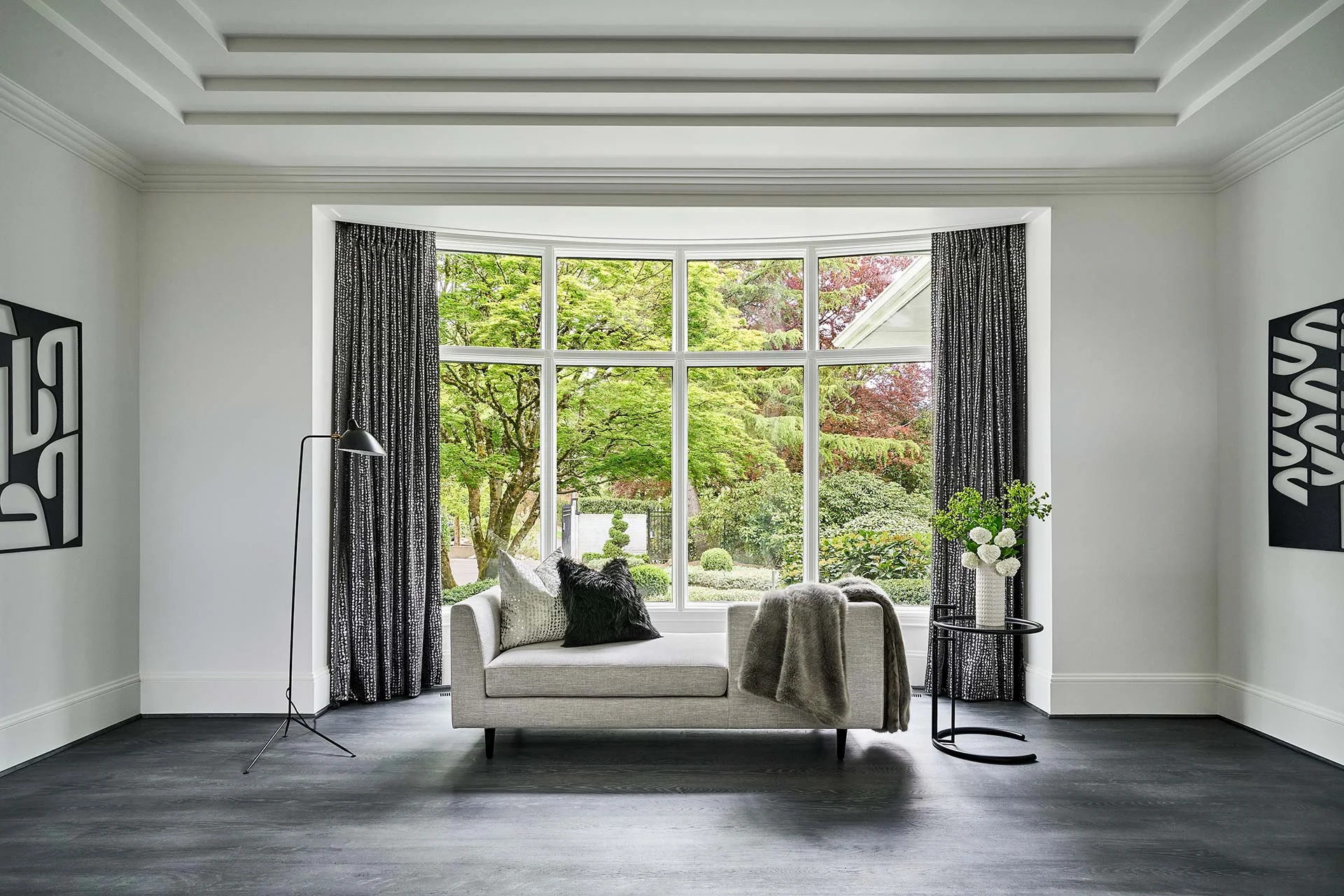 Elegant sitting room overlooking the front courtyard. Photography Credits: Blackstone Edge Studios
