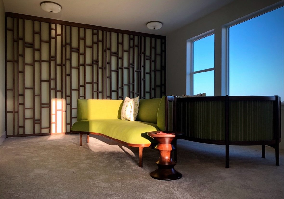 Who says an empty wall needs artwork?

A custom wood feature wall can become the art itself.

Inspired by the organic rhythm of a bamboo forest, this bespoke design blends Mid-Century Modern architecture with Japanese influences to create a warm, tex