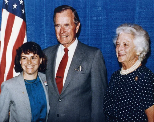 Catherine Bertini stands with Vice President George Bush and Mrs. Barbara Bush in Syracuse in 1986.