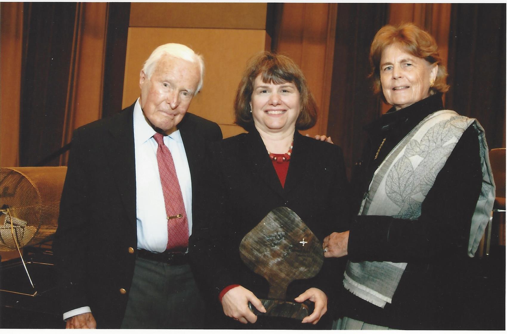  Catherine Bertini holds the Brigid Award with her dear friends Ambassador Robert and Mrs. Lillan Stuart (2010) 