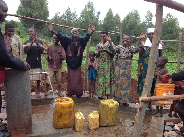 The people are happy to get clean water.JPG