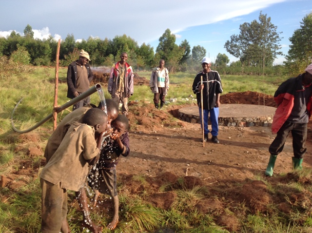 The children are happy to get clean water.JPG