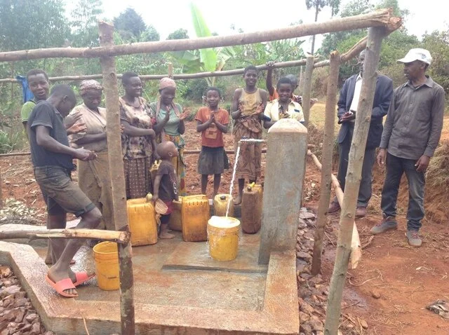 The women are happy to get clean water.JPG