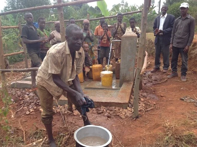 This man is  washing clothes.JPG