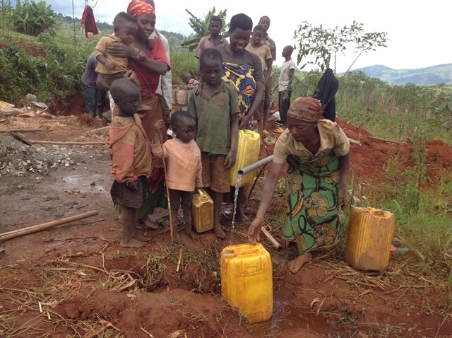 Now the people are now fetching clean water.JPG