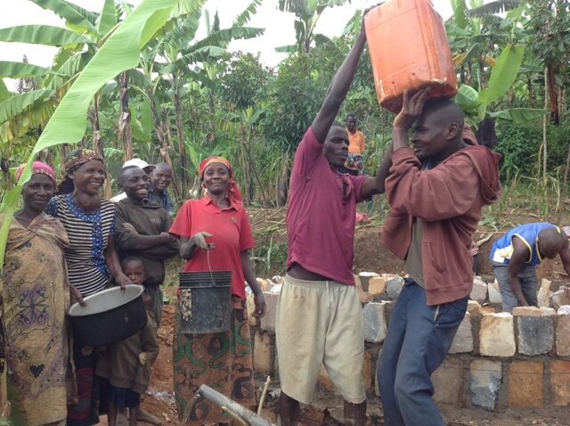 The people are  happy fetching clean water.JPG